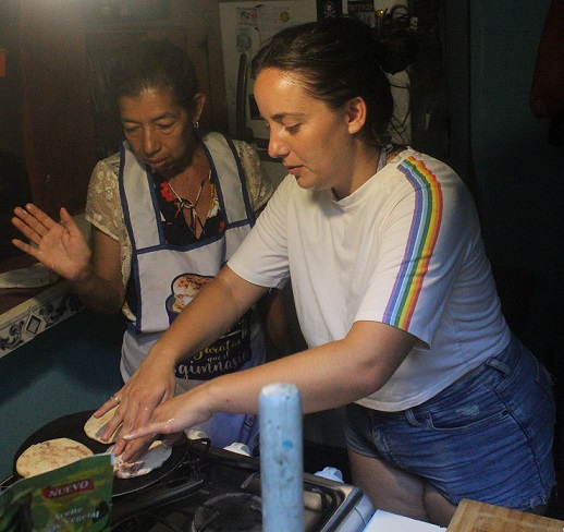 People learning how to do pupusas